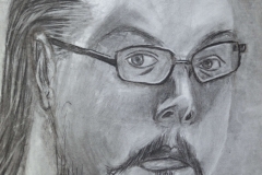 Self-portrait in charcoal